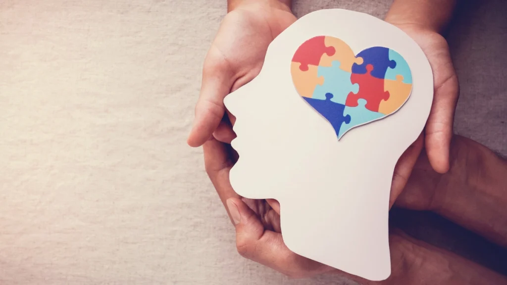 A image of a head with a jigsaw in the shape of a heart